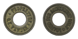 Amusement Token - Property of O.K. Vender with a hole