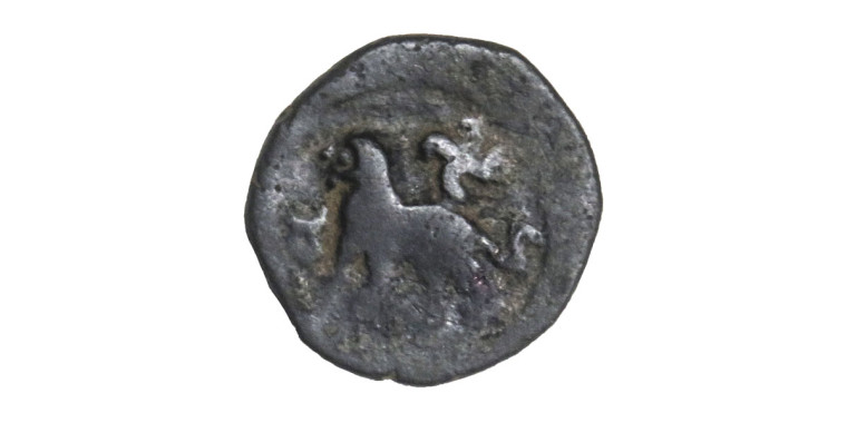 Taxila - Copper coin with lion and Swastika